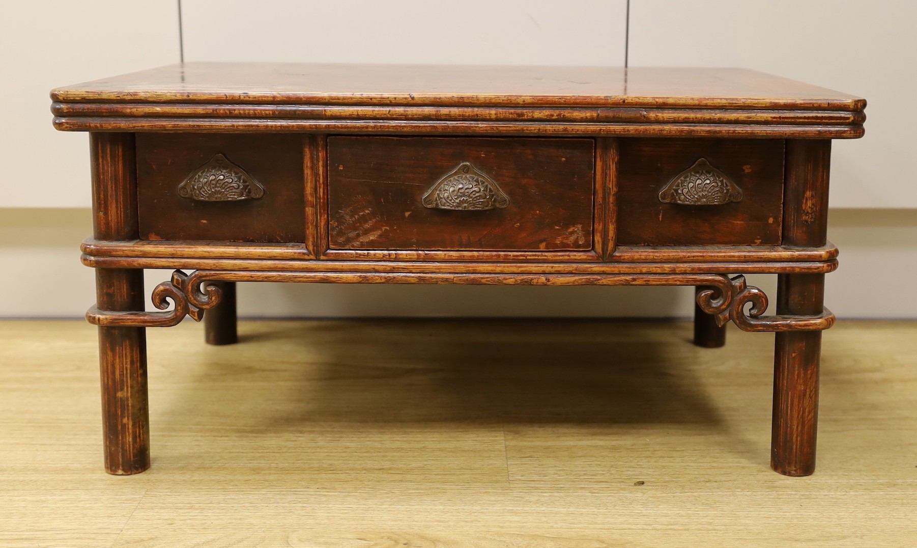 A Chinese elm and bamboo low table, fitted with three freezer drawers 63cms wide x 44cms deep x 32cms high